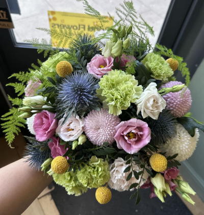 summer freeze - light pink and white bloom ,with a touch of yellow and spiky thistle ,green carnations asparagus